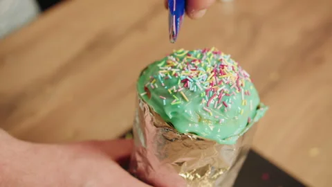 Festive setting with carefully placed colorful cupcake decorations Video stock 330537258