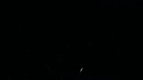 Festive shining firework on bokeh in a black night sky. glowing fireworks sho Stock Footage 136427813