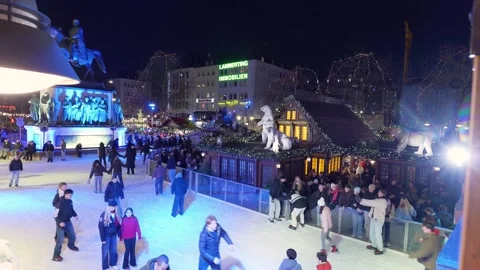 Festive Skating Under Glowing Lights, Historic Plaza Features Illuminated Ice Stock-Footage 328049887