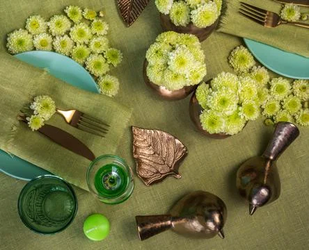 Festive spring table setting with flowers in green tone Stock Photos