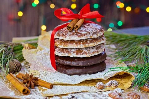 Festive Stack of Gingerbread Cookies with Red Ribbon and Cinnamon Sticks 스톡 사진