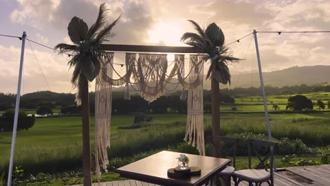 Festive string lights illumination on boho tipi arch decor on outdoor wedding Stock Footage 195167740