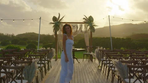 Festive string lights illumination on boho tipi arch decor on outdoor wedding Stock Footage 195626691