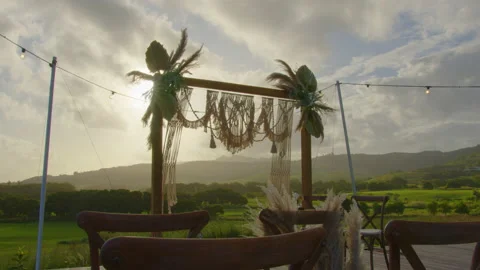 Festive string lights illumination on boho tipi arch decor on outdoor wedding Stock Footage 195947109