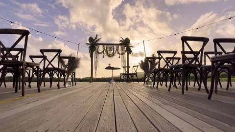 Festive string lights illumination on boho tipi arch decor on outdoor wedding Stock Footage 196218804