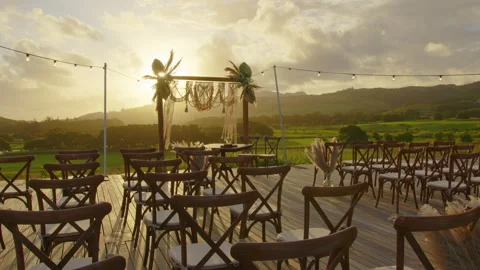 Festive string lights illumination on boho tipi arch decor on outdoor wedding Stock Footage 196966900