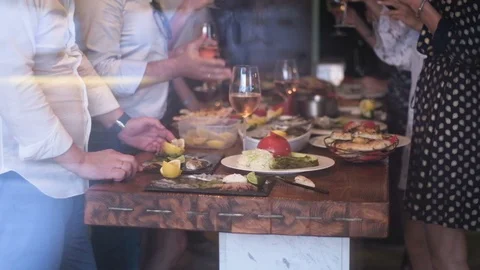 Festive table with appetizers and hands of men and women Stock Footage 95999624
