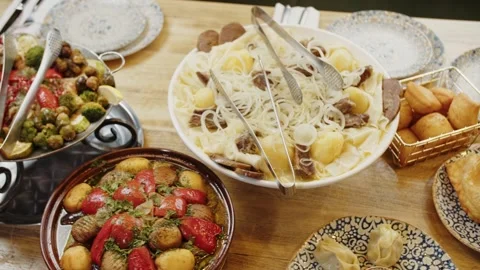 Festive Table with Assorted Dishes and Roasted Vegetables Stock Footage 301528846