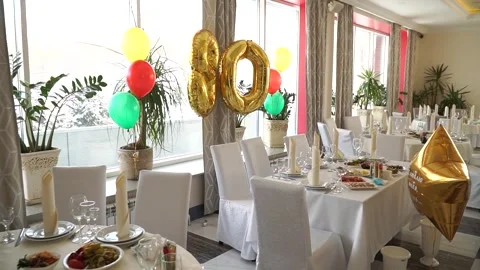 Festive table with balloons for the 80th anniversary Stock Footage 270123743