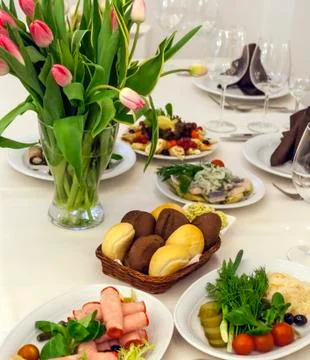 Festive table covered with a white tablecloth Stock Photos