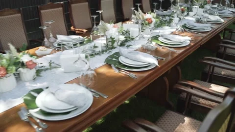 Festive table decor in white and green colours with fresh flowers and grass Stock Footage 170846473