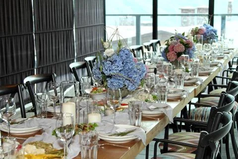 The festive table is decorated with hydrangea flowers Stock Photos