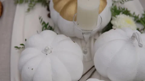 The festive table is decorated with pumpkins, flowers and herbs. Halloween party 스톡 동영상 141972227