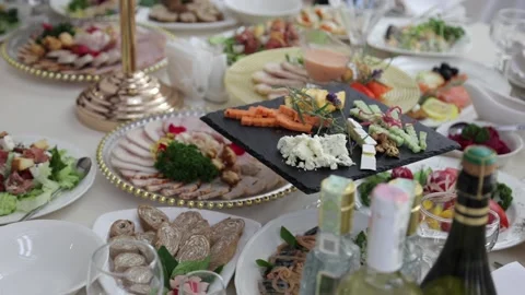 Festive table with delicious dishes. A large selection of dishes Stock Footage 231596165