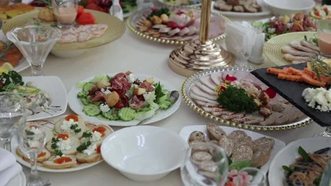 Festive table with delicious dishes. A large selection of dishes Stock Footage 231596166