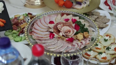 Festive table with delicious dishes. A large selection of dishes Stock Footage 231596170