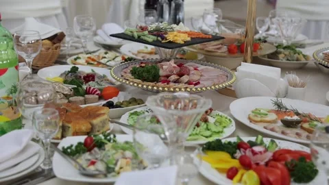 Festive table with delicious dishes. A large selection of dishes Stock Footage 231596172