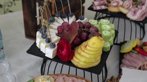 Festive table with delicious snacks. Great selection, whets the appetite Stock Footage 231596179