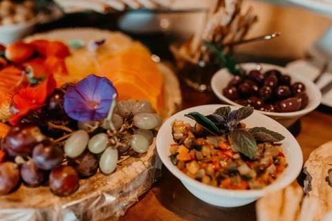 Festive table featuring an array of colorful treats and snacks arranged on a dec Stock Photos