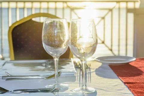 Festive table in the gazebo at sunset Photos