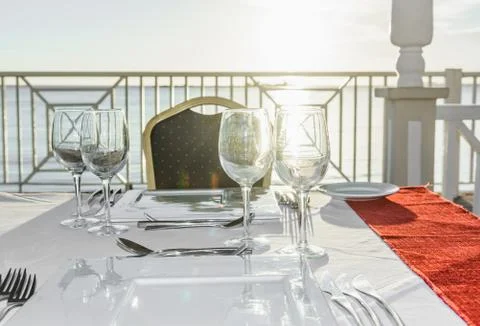 Festive table in the gazebo at sunset Фото