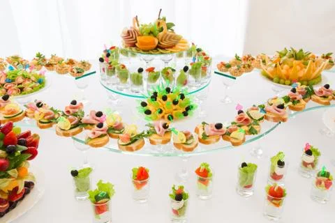 Festive table with light snacks. Wedding banquet. Stock Photos