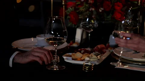 Festive table in a restaurant, loving couple have a dinner Stock Footage 235889014