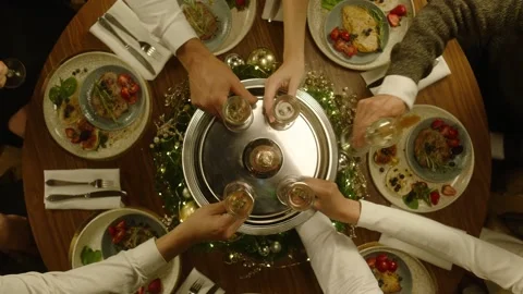 Festive table in a restaurant, people take a glass of champagne, a new year Vidéo 144253267