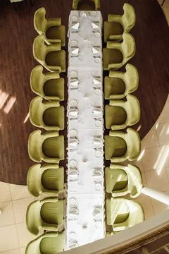 Festive table serving in a restaurant. Classic white set of wedding dinner table Stock Photos