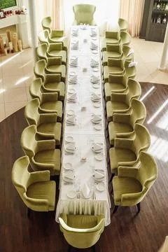Festive table serving in a restaurant. Classic white set of wedding dinner table Stock Photos