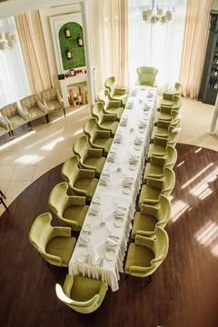 Festive table serving in a restaurant. Classic white set of wedding dinner table Stock Photos