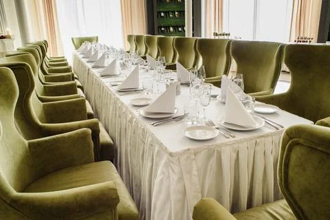 Festive table serving in a restaurant. Classic white set of wedding dinner table Stock Photos