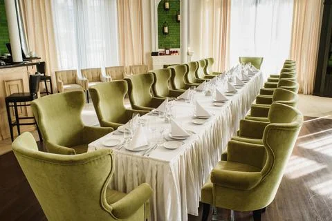Festive table serving in a restaurant. Classic white set of wedding dinner table Stock Photos