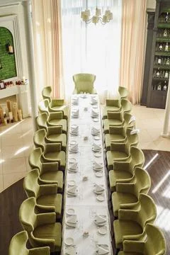 Festive table serving in a restaurant. Classic white set of wedding dinner table Stock Photos