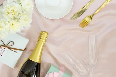 Festive table set concept, Champagne with glass and peony with gift box on .. Stock Photos