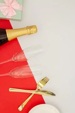 Festive table set concept, Champagne with glass and cutlery with gift box o.. Stock Photos