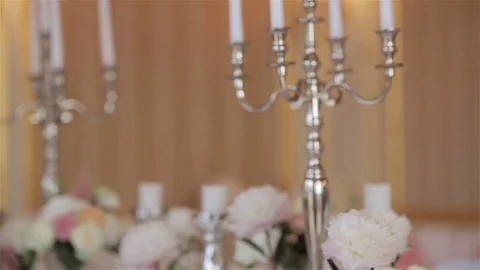 Festive table set for wedding or anniversary reception with candles and flowers Stock Footage 70685110