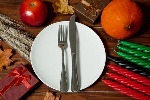 Festive table setting for African American Kwanzaa celebration. Seven candl.. Stock Photos