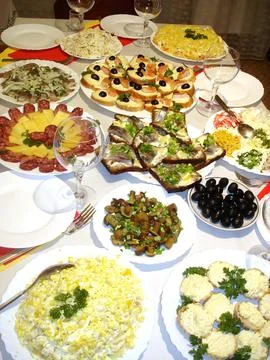 Festive Table Setting With Appetizers and Salads for a Celebration Stock Photos
