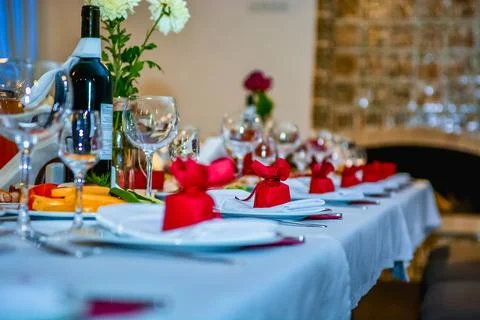 Festive table setting with bread and wine glasses Stock Photos