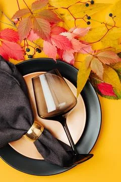 Festive table setting with Bright Autumn leaves on orange background. Flat .. Stock Photos