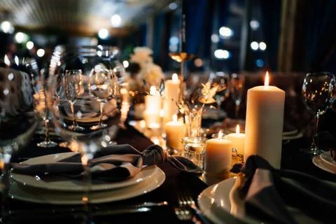 Festive table setting candles for wedding party Stock Photos