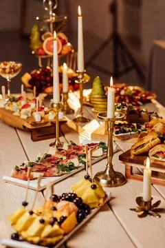 Festive table setting with candles for wedding party in the dark Stock Photos