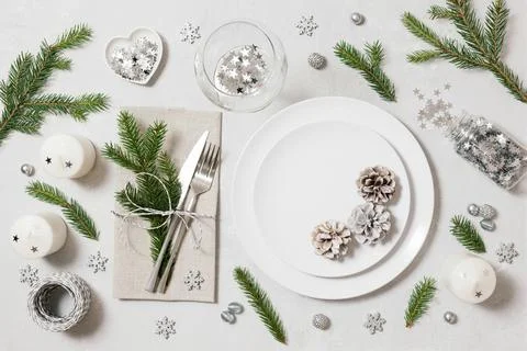 Festive table setting for Christmas dinner on a white background. New Year  Stock Photos