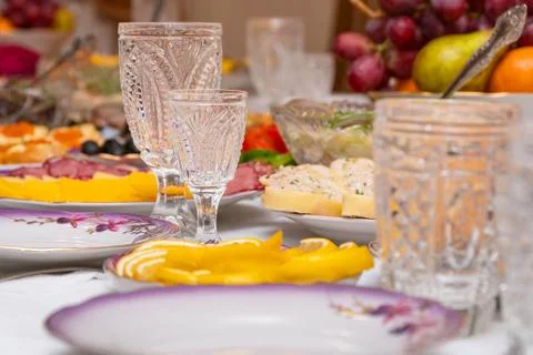 Festive table setting with crystal glasses Stock Photos