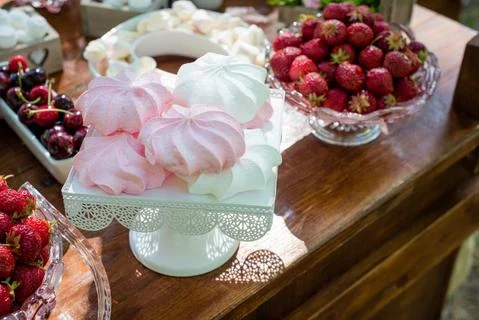 Festive table setting with fruit and marshmallows. Wedding decor. Stock Photos