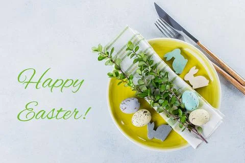 Festive table setting for holiday Easter dinner on light concrete table wit.. Stock Photos