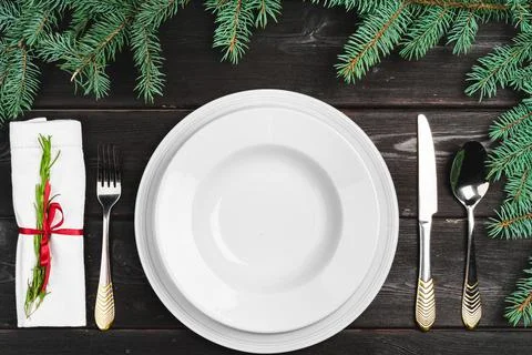 Festive table setting with pine tree branches on wooden background Stock Photos