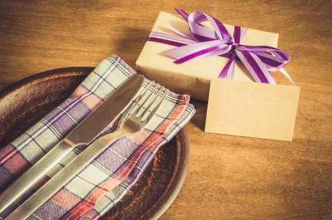 Festive Table Setting with Postcard and Present. Stock Photos