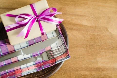 Festive Table Setting with Present. Stock Photos